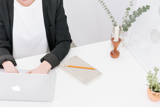 person typing at a desk